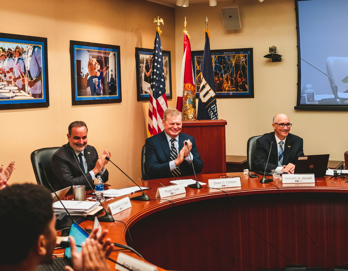 Presidential Search Committee Chair Rogelio Tovar and FIU Board of Trustees chair Dean Colson celebrate Dr. Kenneth A. Jessell's confirmation as FIU's sixth president.